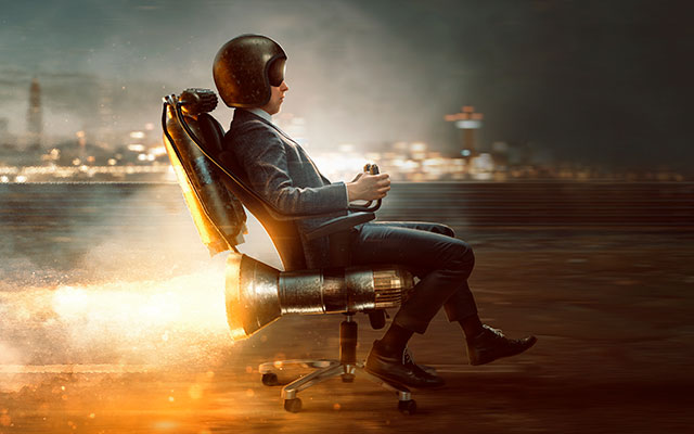 a man sitting in a chair with a jet pack on it