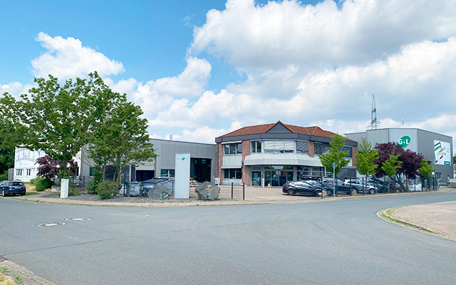 a building with cars parked in front of it